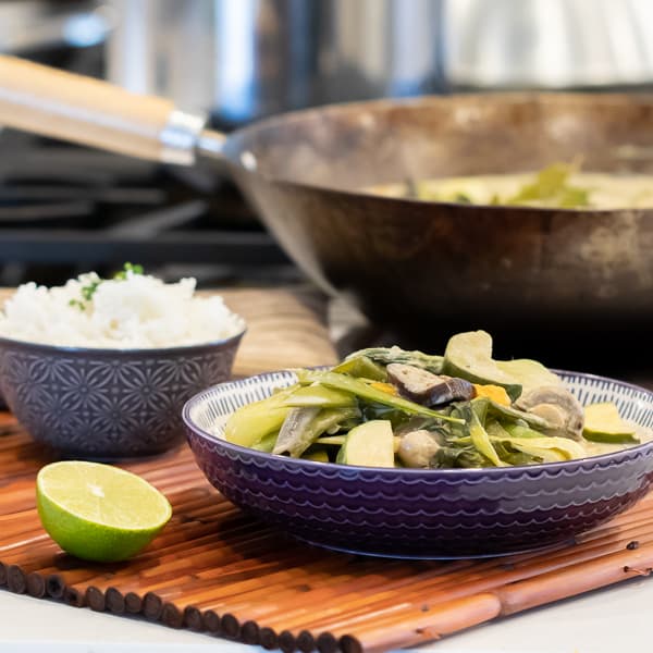 Easy Thai Vegetable Curry with green curry paste and coconut milk. Made with Asian eggplant, baby bok choy, snow peas, mushrooms, zucchini, pepper and more! Serve on jasmine rice. 