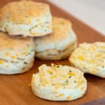 Simple recipe for how to bake cheddar cheese and chive biscuits that are buttery, flakey and simple to make in the oven. Similar to scones, these fresh baked and similar to Red Lobster's Cheddar Bay biscuits.