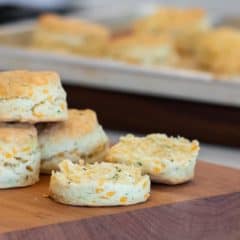 Simple recipe for how to bake cheddar cheese biscuits that are buttery, flakey and simple to make in the oven. Fresh baked and similar to Red Lobster's Cheddar Bay biscuits.