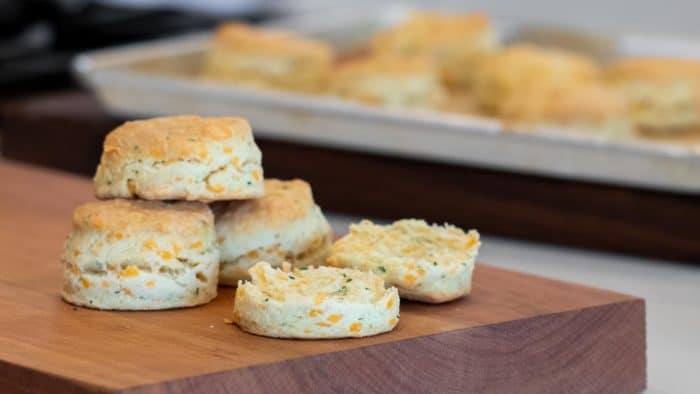 Simple recipe for how to bake cheddar cheese biscuits that are buttery, flakey and simple to make in the oven. Fresh baked and similar to Red Lobster's Cheddar Bay biscuits.