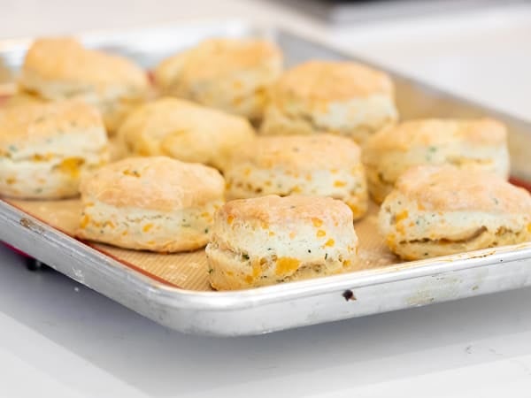 Simple recipe for how to bake cheddar cheese biscuits that are buttery, flakey and simple to make in the oven. Fresh baked and similar to Red Lobster's Cheddar Bay biscuits.