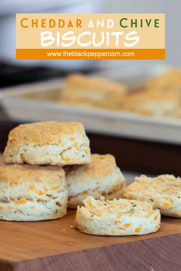 Simple recipe for how to bake cheddar cheese and chive biscuits that are buttery, flakey and simple to make in the oven. Fresh baked and similar to Red Lobster's Cheddar Bay biscuits.