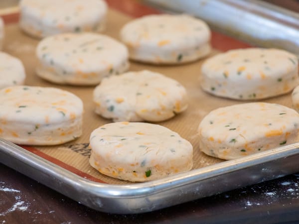 Simple recipe for how to bake cheddar cheese biscuits that are buttery, flakey and simple to make in the oven. Fresh baked and similar to Red Lobster's Cheddar Bay biscuits.