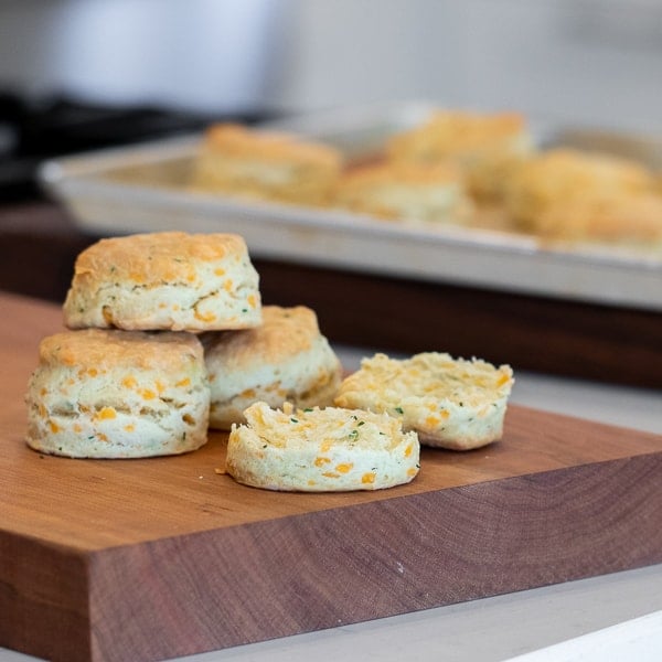 Simple recipe for how to bake cheddar cheese biscuits that are buttery, flakey and simple to make in the oven. Fresh baked and similar to Red Lobster's Cheddar Bay biscuits.