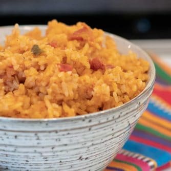 Easy recipe for Mexican rice that is a perfect side dish for a Mexican dinner. Made with rice, salsa & cheese - great in burritos, tacos, fajitas and more.