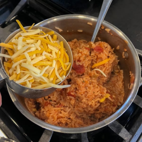 Easy recipe for Mexican rice that is a perfect side dish for a Mexican dinner. Made with rice, salsa & cheese - great in burritos, tacos, fajitas and more.