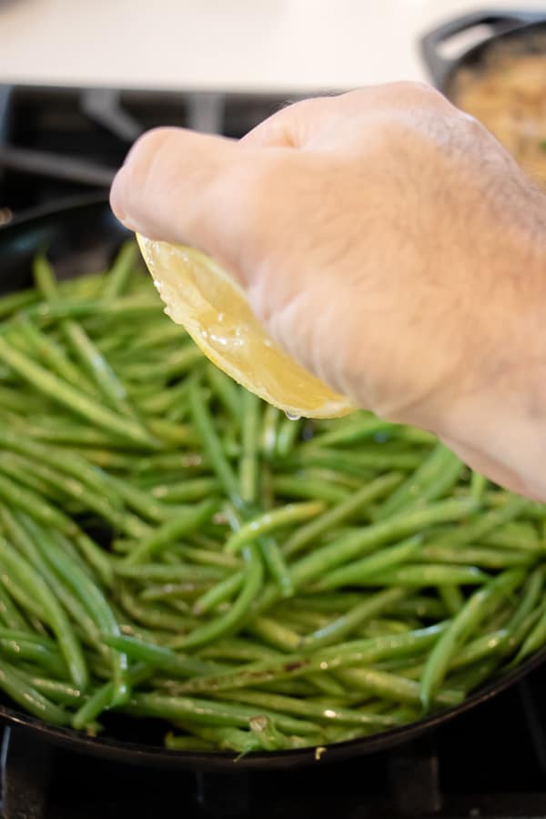 Easy side dish recipe for fresh sautéed green beans with walnuts, dried cherries, lemon zest and lemon juice.