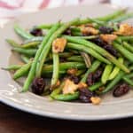 Easy side dish recipe for fresh sautéed green beans with walnuts, dried cherries, lemon zest and lemon juice.