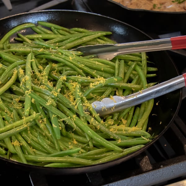 Easy side dish recipe for fresh sautéed green beans with walnuts, dried cherries, lemon zest and lemon juice.