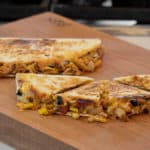 Easy recipe for Mexican quesadilla made with chicken, black beans, corn, cheddar cheese and Monterey jack. Folded and cooked on a skillet or griddle.