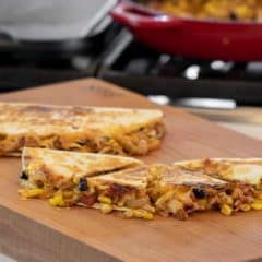 Easy recipe for Mexican quesadilla made with chicken, black beans, corn, cheddar cheese and Monterey jack. Folded and cooked on a skillet or griddle.