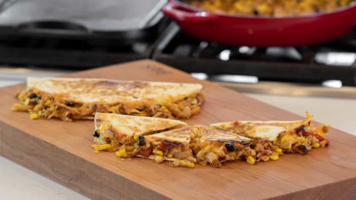Easy recipe for Mexican quesadilla made with chicken, black beans, corn, cheddar cheese and Monterey jack. Folded and cooked on a skillet or griddle.