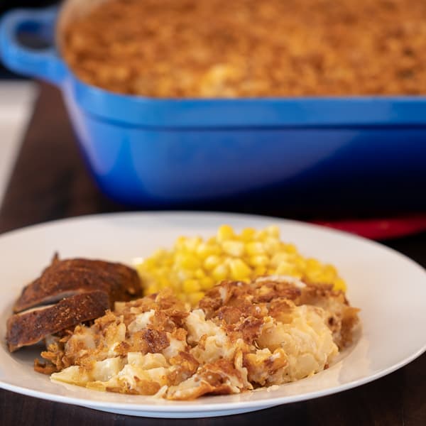 Easy hash brown casserole made with frozen hash browns, cream of mushroom soup, sour cream and cheddar cheese. Oven baked casserole that is a great side dish.