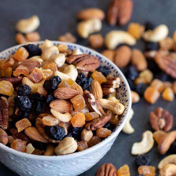 Healthy trail mix of dried fruit and nuts. Pecans, almonds and cashews combine with the dried blueberries and apricots to make a trail mix perfect for snacking!