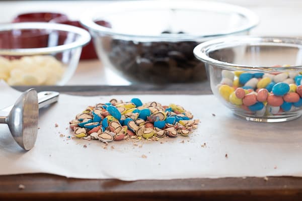 Chocolate bark with a holiday Easter theme. Sweet dessert treat made with dark chocolate melts, white chocolate, malt Easter eggs and sprinkles.