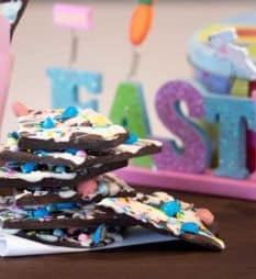 Chocolate bark with a holiday Easter theme. Sweet dessert treat made with dark chocolate melts, white chocolate, malt Easter eggs and sprinkles.