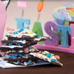 Chocolate bark with a holiday Easter theme. Sweet dessert treat made with dark chocolate melts, white chocolate, malt Easter eggs and sprinkles.