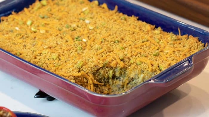 Easy baked cheesy eggplant casserole recipe. How to make with cream of mushroom soup and baked with cheddar cheese, bread crumbs and green onions.