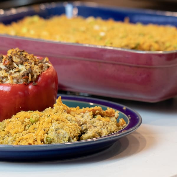 Easy baked cheesy eggplant casserole recipe. How to make with cream of mushroom soup and baked with cheddar cheese, bread crumbs and green onions.