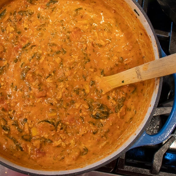 Easy pasta recipe with cheese filled tortellini, ground turkey, zucchini and spinach in a creamy tomato marinara sauce.