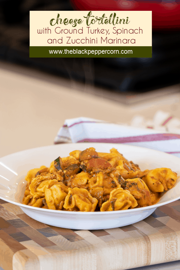 Easy pasta recipe with cheese filled tortellini, ground turkey, zucchini and spinach in a creamy tomato marinara sauce.