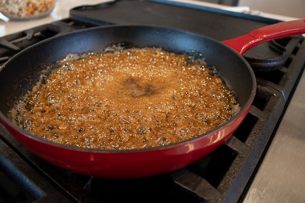 Candied pecans is super easy to make on the stovetop with this recipe. These taste just like praline pecans and made with brown sugar, cinnamon, salt and cayenne.