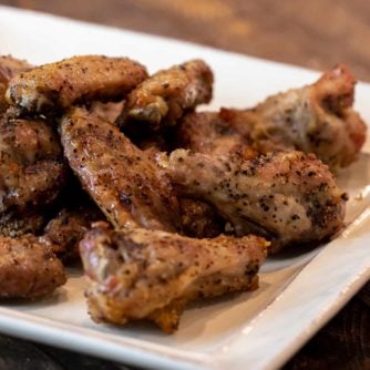 How to cook wings in Air Fryer that are crispy and taste like they are deep fried. Simple instructions for basic salt and pepper chicken wings. Add sauce after for sweet and sticky wings.