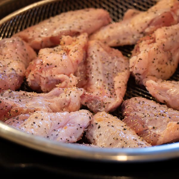 How to cook wings in Air Fryer that are crispy and taste like they are deep fried. Simple instructions for basic salt and pepper chicken wings. Add sauce after for sweet and sticky wings.