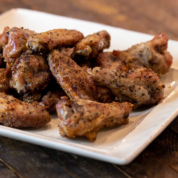 How to cook wings in Air Fryer that are crispy and taste like they are deep fried. Simple instructions for basic salt and pepper chicken wings. Add sauce after for sweet and sticky wings.