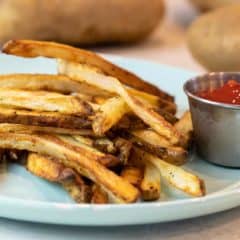 Easy instructions for how to make french fries in an air fryer. Crispy and tastes just like deep fried but this recipe uses very little oil. Russet potatoes make the perfect french fries.