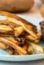 Easy instructions for how to make french fries in an air fryer. Crispy and tastes just like deep fried but this recipe uses very little oil. Russet potatoes make the perfect french fries.