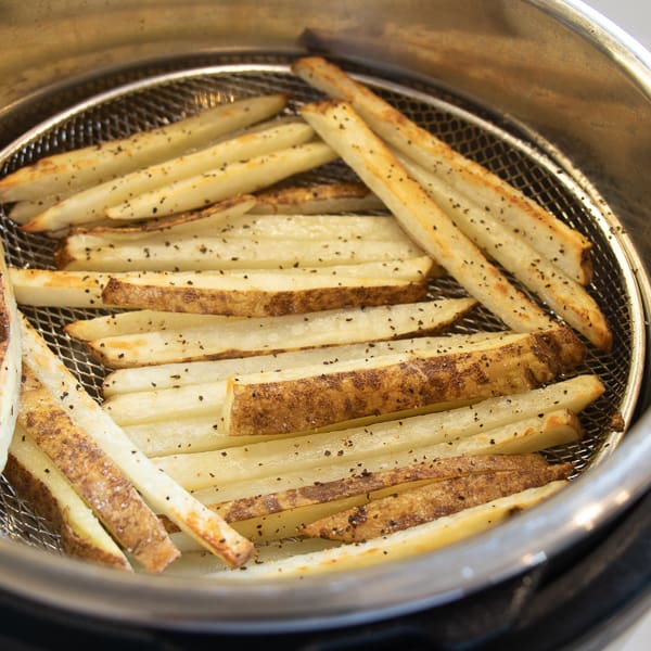 Easy instructions for how to make french fries in an air fryer. Crispy and tastes just like deep fried but this recipe uses very little oil. Russet potatoes make the perfect french fries.