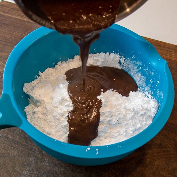 Easy Texas sheet cake recipe made in a 18x13 half sheet pan. Thin layer chocolate cake with fudge like icing. Moist cake made with butter, cocoa, sour cream.