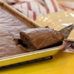 Easy Texas sheet cake recipe made in a 18x13 half sheet pan. Thin layer chocolate cake with fudge like icing. Moist cake made with butter, cocoa, sour cream.