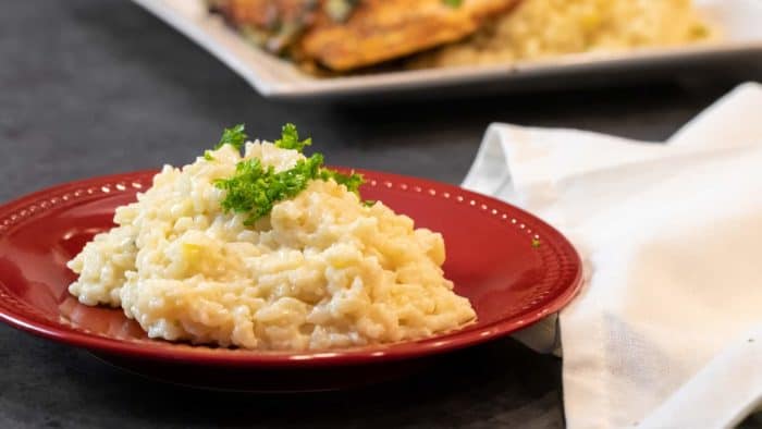 Easy instructions for how to make risotto at home so that it is creamy and tastes just like a restaurant. Made with arborio rice, parmesan cheese, lemon, broth and more.