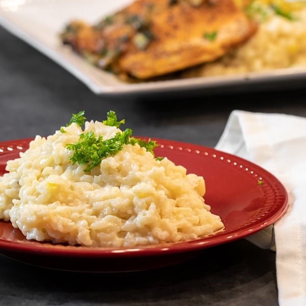 Easy instructions for how to make risotto at home so that it is creamy and tastes just like a restaurant. Made with arborio rice, parmesan cheese, lemon, broth and more.