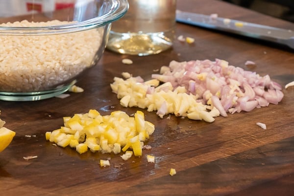 Easy instructions for how to make risotto at home so that it is creamy and tastes just like a restaurant. Made with arborio rice, parmesan cheese, lemon, broth and more.