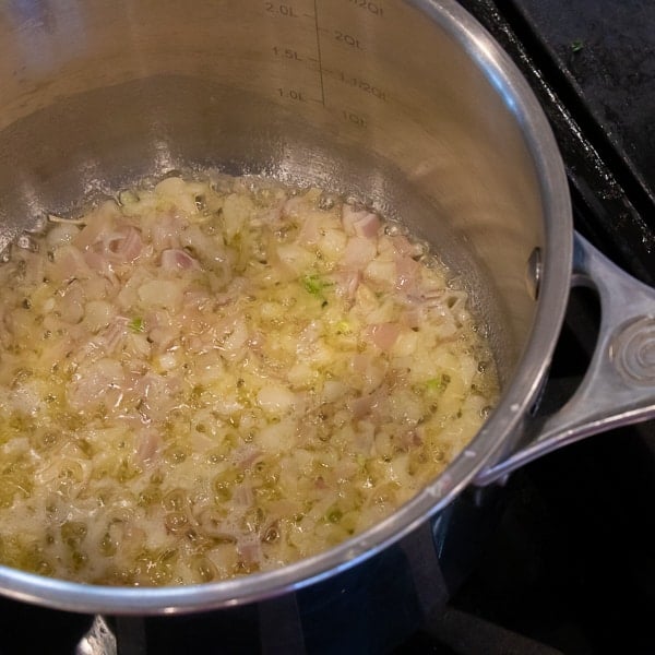 Easy instructions for how to make risotto at home so that it is creamy and tastes just like a restaurant. Made with arborio rice, parmesan cheese, lemon, broth and more.