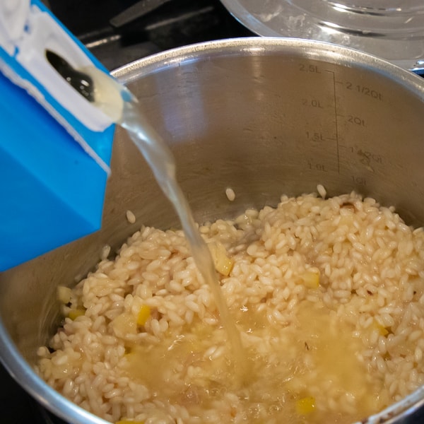 Easy instructions for how to make risotto at home so that it is creamy and tastes just like a restaurant. Made with arborio rice, parmesan cheese, lemon, broth and more.