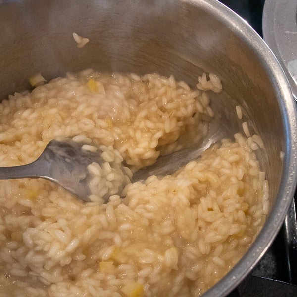 Easy instructions for how to make risotto at home so that it is creamy and tastes just like a restaurant. Made with arborio rice, parmesan cheese, lemon, broth and more.