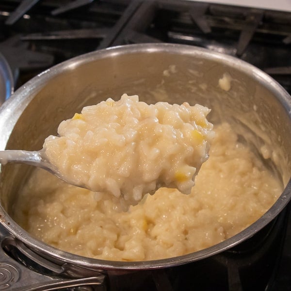 Easy instructions for how to make risotto at home so that it is creamy and tastes just like a restaurant. Made with arborio rice, parmesan cheese, lemon, broth and more.