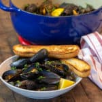 Steamed mussels recipe with white wine, shallots, garlic and butter. The best mussels could not be easier to make at home with this simple and delicious recipe.