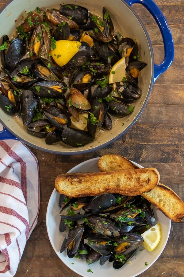 Steamed mussels recipe with white wine, shallots, garlic and butter. The best mussels could not be easier to make at home with this simple and delicious recipe.