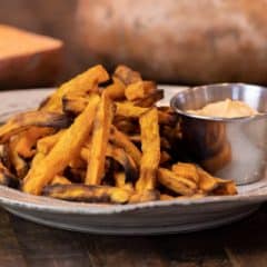 Easy instructions for how to make sweet potato french fries in an air fryer. Crispy and tastes just like deep fried but this recipe uses very little oil. Sweet potatoes make the perfect fries.