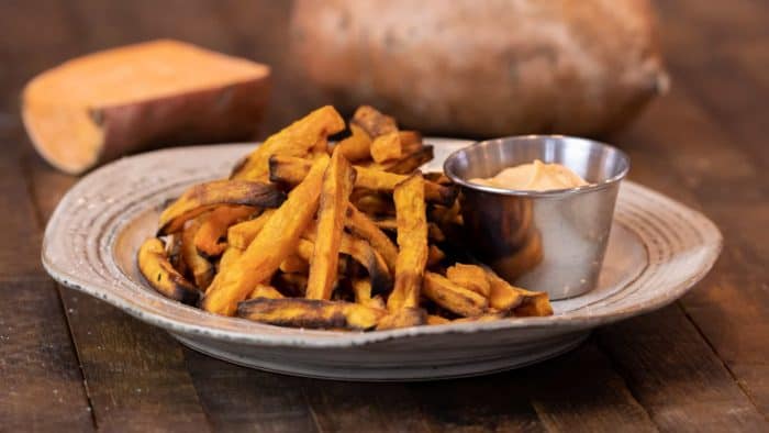 Easy instructions for how to make sweet potato french fries in an air fryer. Crispy and tastes just like deep fried but this recipe uses very little oil. Sweet potatoes make the perfect fries.