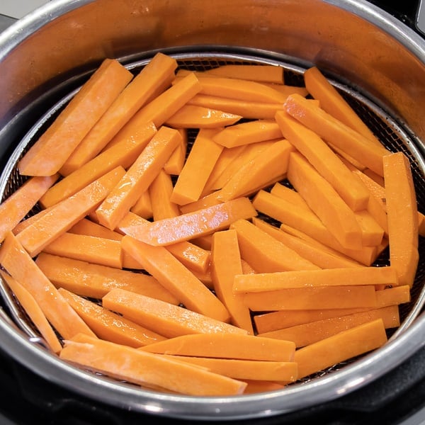 Air Fryer Sweet Potato Fries Recipe - Easy instructions for how to make sweet potato french fries in an air fryer. Crispy and tastes just like deep fried but this recipe uses very little oil. Sweet potatoes make the perfect fries.