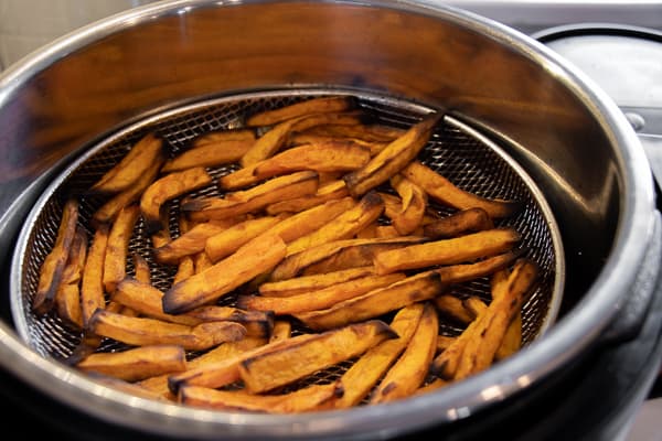 Air Fryer Sweet Potato Fries Recipe - Easy instructions for how to make sweet potato french fries in an air fryer. Crispy and tastes just like deep fried but this recipe uses very little oil. Sweet potatoes make the perfect fries.