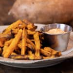 Easy instructions for how to make sweet potato french fries in an air fryer. Crispy and tastes just like deep fried but this recipe uses very little oil. Sweet potatoes make the perfect fries.