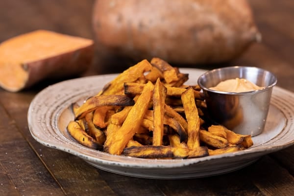 Easy instructions for how to make sweet potato french fries in an air fryer. Crispy and tastes just like deep fried but this recipe uses very little oil. Sweet potatoes make the perfect fries.