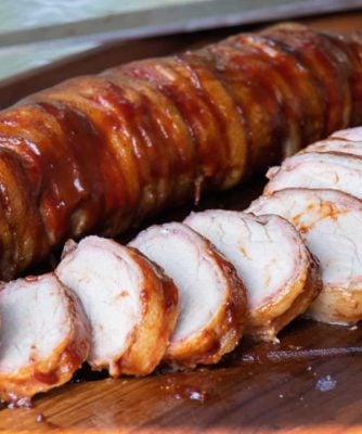 A delicious BBQ recipe of bacon wrapped smoked pork tenderloin with cajun seasoning.